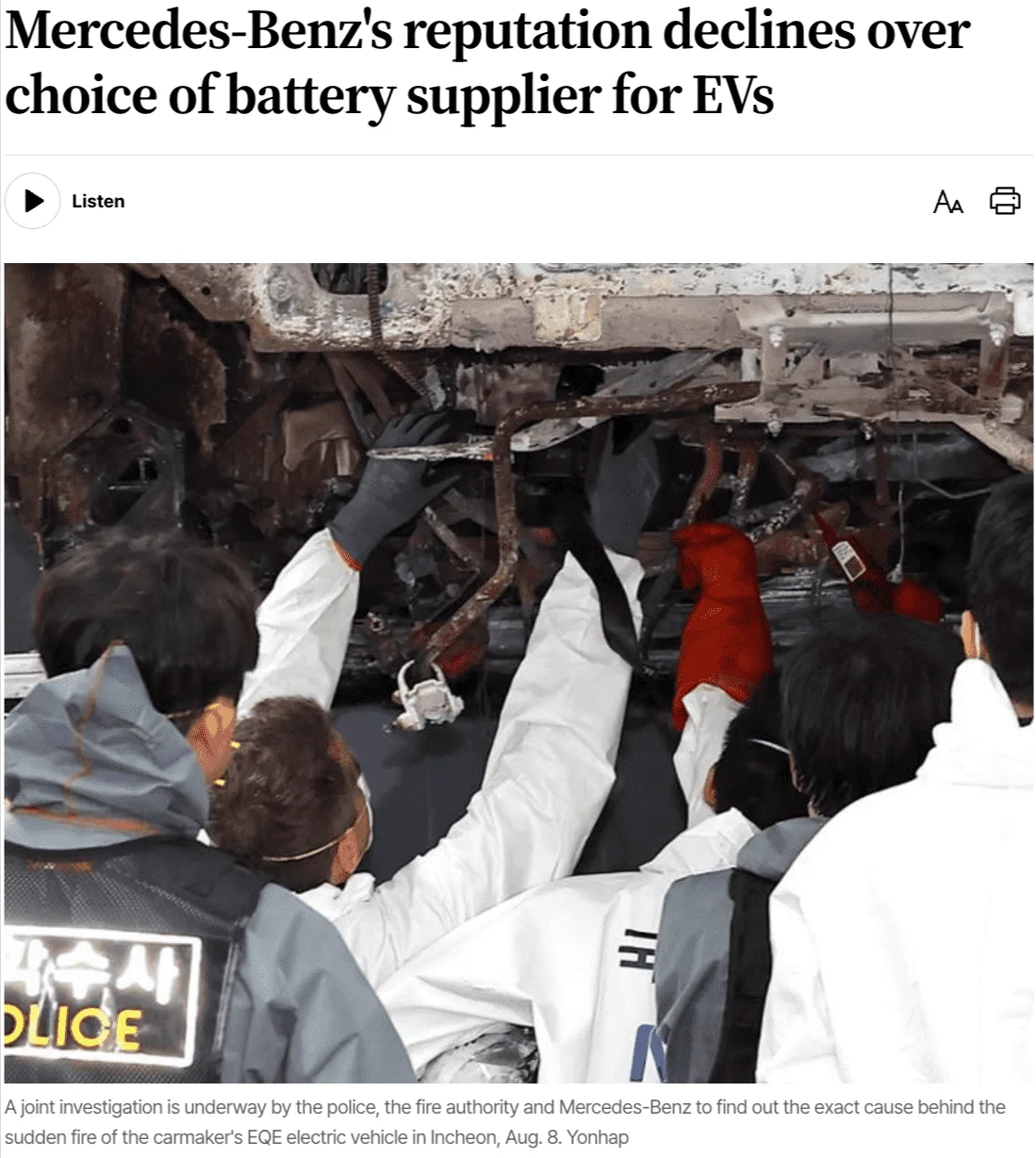 Investigators examine the burnt underside of a Mercedes-Benz EQE electric vehicle after a fire incident in Incheon